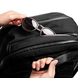 Bellroy Transit Backpack Plus in black with zipped compartments and smooth textured fabric detail