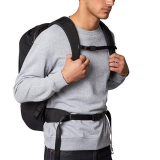Bellroy Transit Backpack Plus worn by man in gray sweatshirt with adjustable chest and waist straps