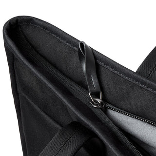 Bellroy Tokyo Tote Second Edition in black fabric showing top zipper and leather pull tab detail