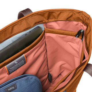 Bellroy Tokyo Tote Second Edition showing organized interior pockets and soft fabric lining in burnt orange color