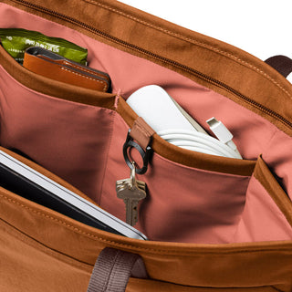 Bellroy Tokyo Tote Second Edition with organized inner pockets holding wallet, charger, keys, and snacks