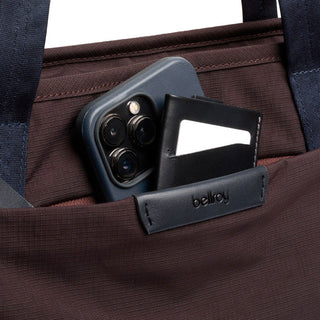 Bellroy Tokyo Tote Second Edition close-up of brown woven fabric pocket holding phone and wallet