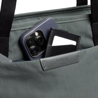 Bellroy Tokyo Tote Second Edition pocket detail showing water-resistant fabric and stitching with phone and wallet inside