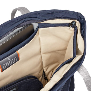 Bellroy Tokyo Tote Second Edition open interior showing navy exterior and cream lining with storage compartments