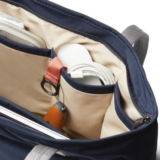 Bellroy Tokyo Tote Second Edition showing organized interior pockets with cream lining and navy blue exterior
