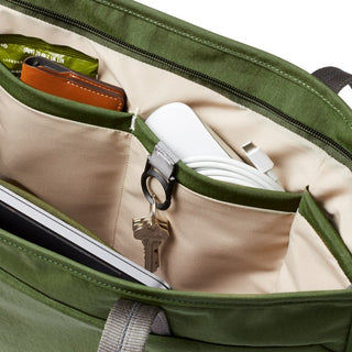 Bellroy Tokyo Tote Second Edition interior with organized pockets, key clip, and cream fabric lining in green tote