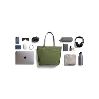 Bellroy Tokyo Tote Second Edition in olive green with leather handles and organized everyday essentials displayed nearby