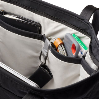 Bellroy Tokyo Tote Second Edition interior showing organized compartments with personal and tech items inside