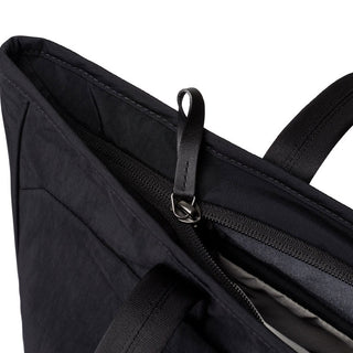 Bellroy Tokyo Tote Second Edition black woven fabric tote with leather zipper pull and top handle close-up