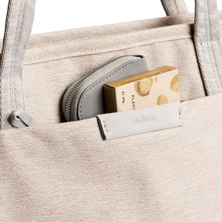 Bellroy Tokyo Tote Second Edition in light fabric showing front pocket with zipper pouch and small box inside