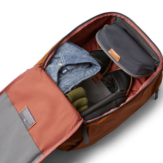 Bellroy Transit Workpack 20L open showing organized interior compartments and clothing inside