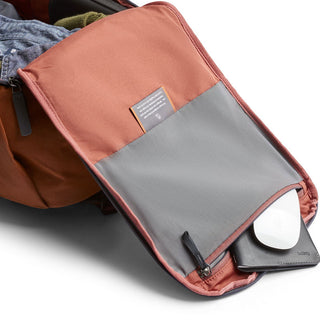 Bellroy Transit Workpack 20L open showing organized interior pockets with soft fabric and leather details