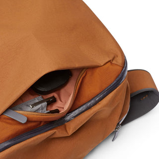 Bellroy Transit Workpack 20L in tan with partially opened main compartment showing interior fabric and zipper detail