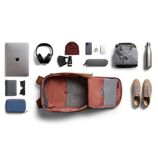 Bellroy Transit Workpack 20L open showing organized compartments with everyday items laid out nearby