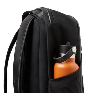 Bellroy Transit Workpack 20L (Second Edition) black backpack side pocket with orange water bottle visible