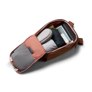 Bellroy Transit Workpack 20L (Second Edition) open with organized compartments and packed essentials in rust color
