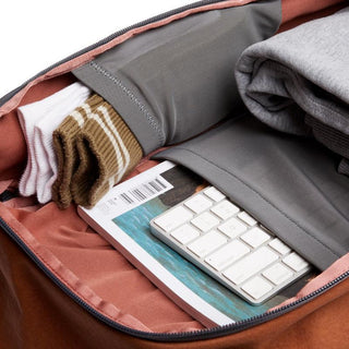 Bellroy Transit Workpack 20L (Second Edition) showing organized interior with folded clothes and tech accessories