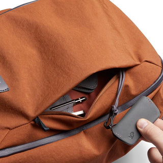 Bellroy Transit Workpack 20L (Second Edition) in rust with durable fabric and front zip pocket detail