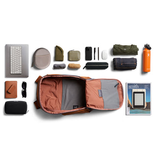 Bellroy Transit Workpack 20L (Second Edition) open flat with organized tech and travel essentials inside and around it