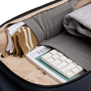 Bellroy Transit Workpack 20L (Second Edition) interior showing organized compartments with clothing and keyboard storage