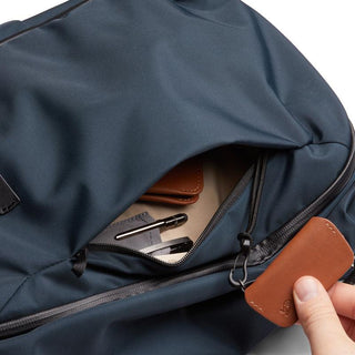 Bellroy Transit Workpack 20L (Second Edition) navy backpack with leather zipper pull and interior contents visible