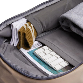Bellroy Transit Workpack 20L (Second Edition) with organized interior pockets holding socks, keyboard, and clothing