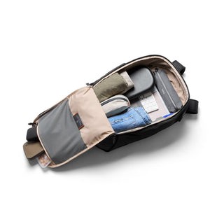 Bellroy Transit Workpack 26L backpack open with organized compartments and everyday carry items inside