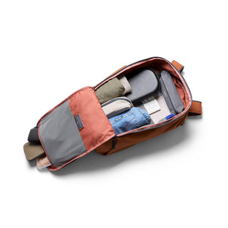 Bellroy Transit Workpack 26L in rust with organized interior compartments and packed essentials