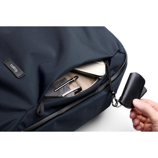 Bellroy Transit Workpack 26L navy blue fabric with front pocket holding tech and accessories