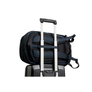 Bellroy Transit Workpack 26L attached to suitcase handle showing padded straps and durable fabric texture