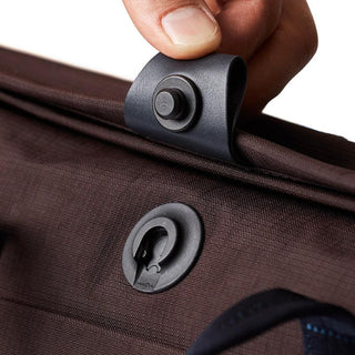 Close-up of Bellroy Tokyo Messenger Bag 14" brown recycled fabric snap button closure detail