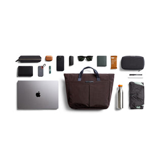 Bellroy Tokyo Messenger Bag 14" in dark brown with multiple everyday accessories arranged neatly nearby