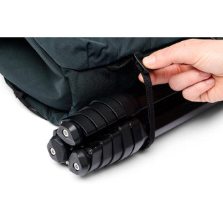 Bellroy Venture Sling 10L - Camera Edition in dark fabric securing a black tripod with a strap buckle