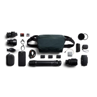 Bellroy Venture Sling 10L - Camera Edition in dark recycled fabric with camera gear laid out around it