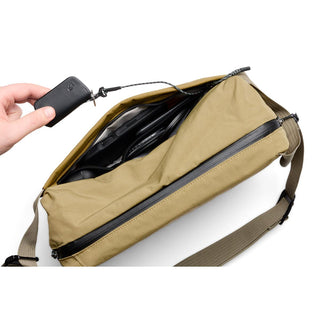 Bellroy Venture Sling 10L - Camera Edition in tan showing spacious interior with leather accessory pull tab