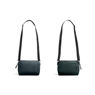 Bellroy Venture Travel Crossbody bag in navy recycled fabric with adjustable black strap front and back views