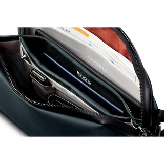 Bellroy Venture Travel Crossbody showing organized interior with multiple pockets and RFID protection lining