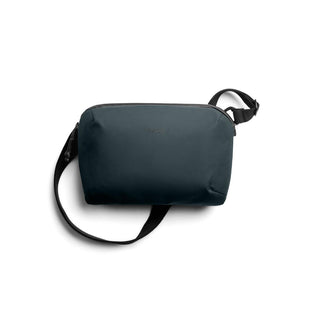 Bellroy Venture Travel Crossbody in dark navy with smooth recycled fabric and adjustable strap