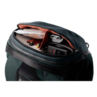 Bellroy Venture Travel Pack 26L showing organized interior with tech and travel essentials in recycled fabric