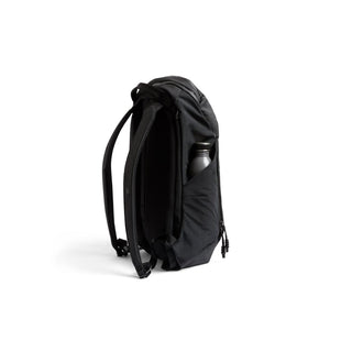 Bellroy Venture Ready Pack 20L in black showing side water bottle pocket and padded straps side view