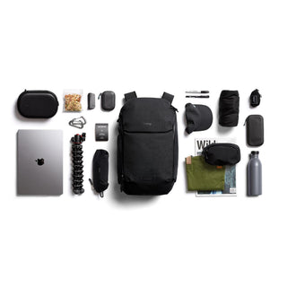 Bellroy Venture Ready Pack 20L black backpack with organized tech, accessories, and travel essentials laid out