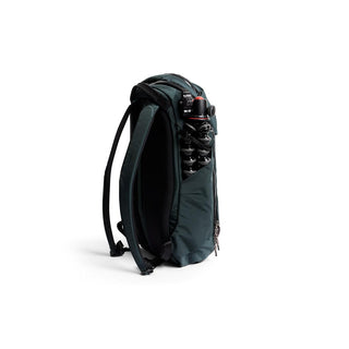 Bellroy Venture Ready Pack 20L in dark green with padded straps and tripod storage pocket visible from side angle