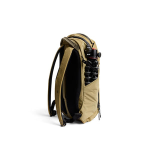 Bellroy Venture Ready Pack 20L in tan with side pocket holding camera gear and padded straps visible