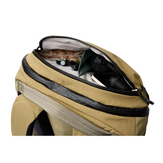 Bellroy Venture Ready Pack 20L in tan with open top compartment showing interior storage details