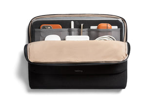 Bellroy Laptop Caddy 16" in black with organized compartments for tech accessories and cords