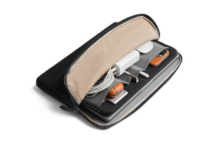 Bellroy Laptop Caddy 14" with organized tech accessories in black fabric and beige interior lining