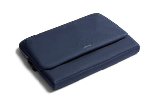 Bellroy Laptop Caddy 16 in navy blue recycled fabric with slim, padded design and zipper closure