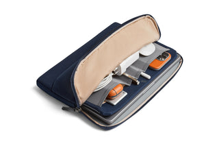 Bellroy Laptop Caddy 16" in navy with organized compartments for tech accessories and cables inside