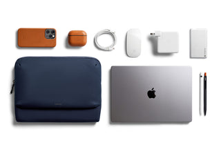 Bellroy Laptop Caddy 16 navy blue with tech accessories laid out on white background