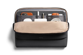 Bellroy Laptop Caddy 14" with organized compartments holding tech accessories and personal items in black material